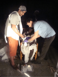 Here Jesse (left) is shown bandaging a badly injured Haitian women hours after the earthquake struck on January 12th, 2010.